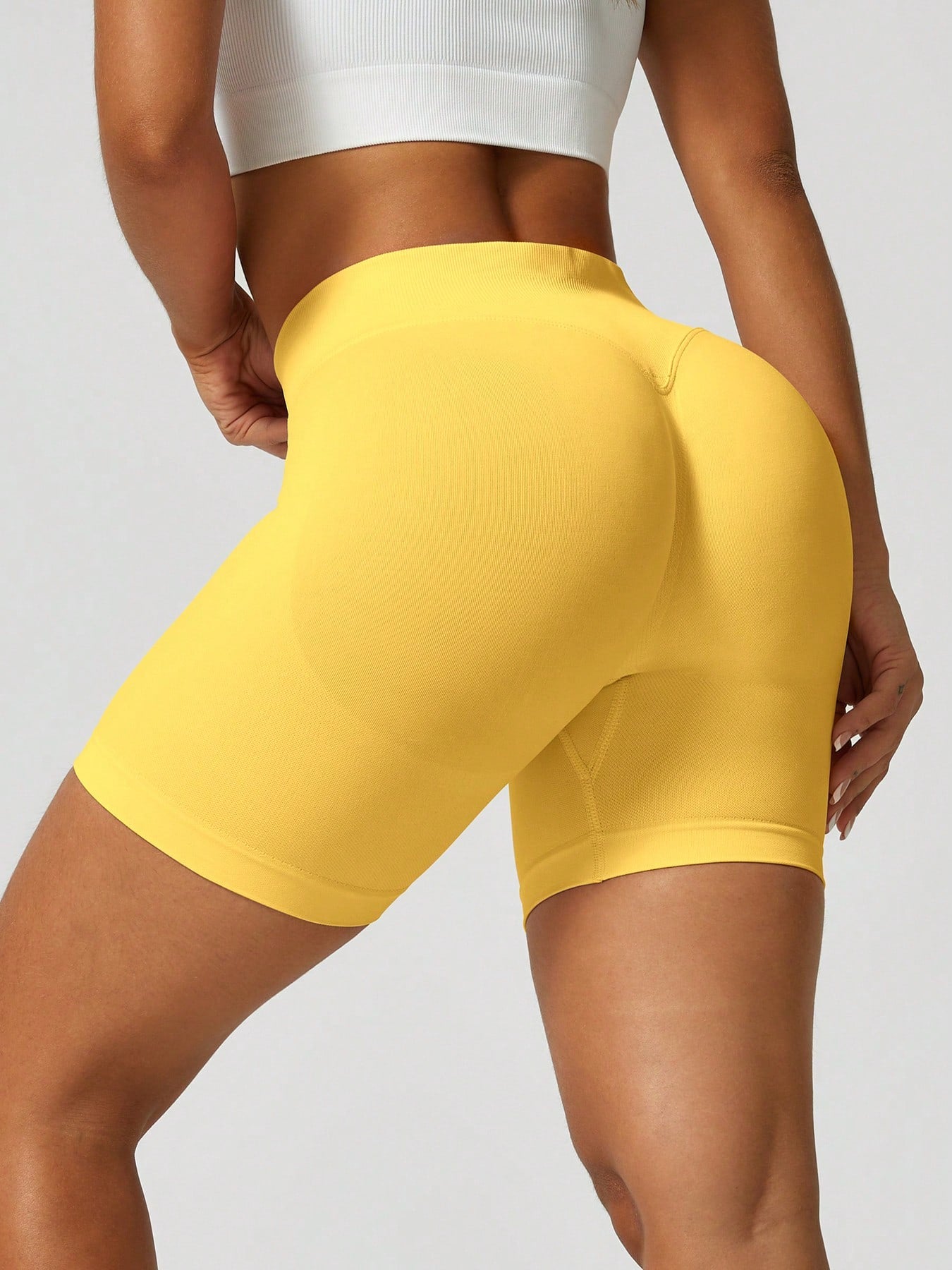Sculpt high-rise seamless shorts The Quiet & Co. — back view natural shape — Yellow