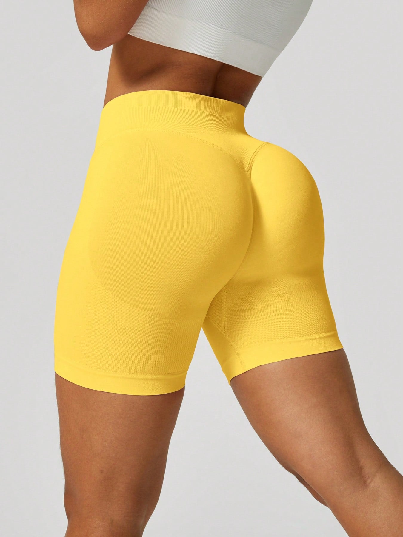 Sculpt high-rise seamless shorts The Quiet & Co. — back view natural shape — Yellow