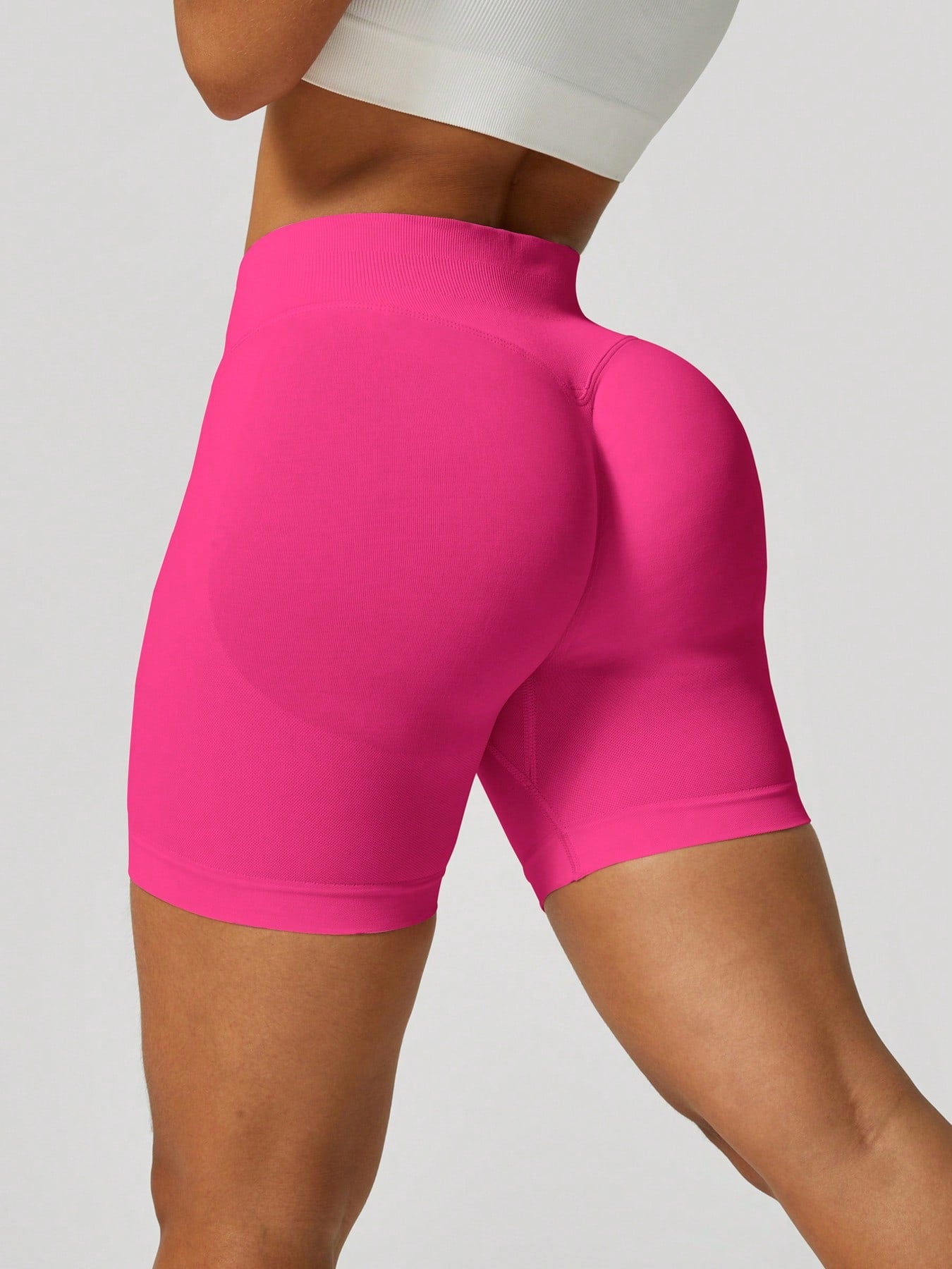 Sculpt high-rise seamless shorts The Quiet & Co. — back view natural shape — Hot Pink