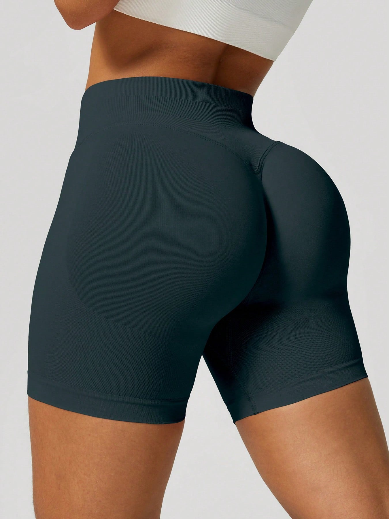 Sculpt high-rise seamless shorts The Quiet & Co. — back view natural shape — Dark Green