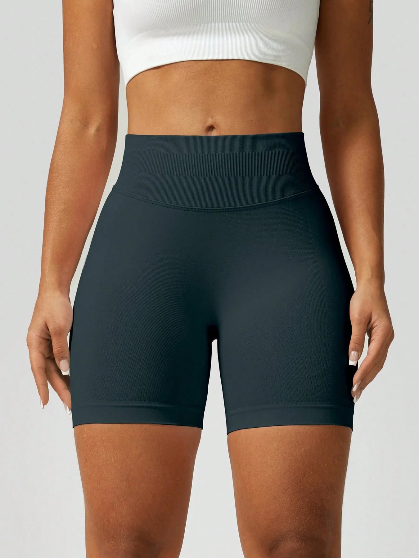Sculpt high-rise seamless shorts The Quiet & Co. — back view natural shape — Dark Green