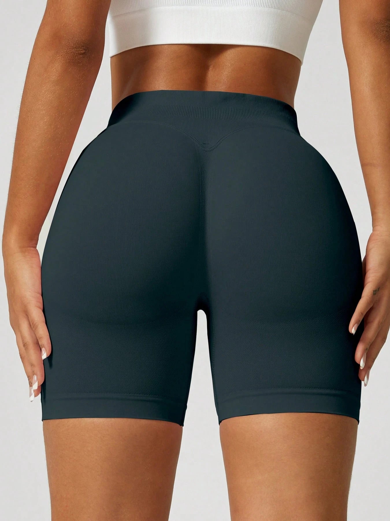 Sculpt high-rise seamless shorts The Quiet & Co. — back view natural shape — Dark Green
