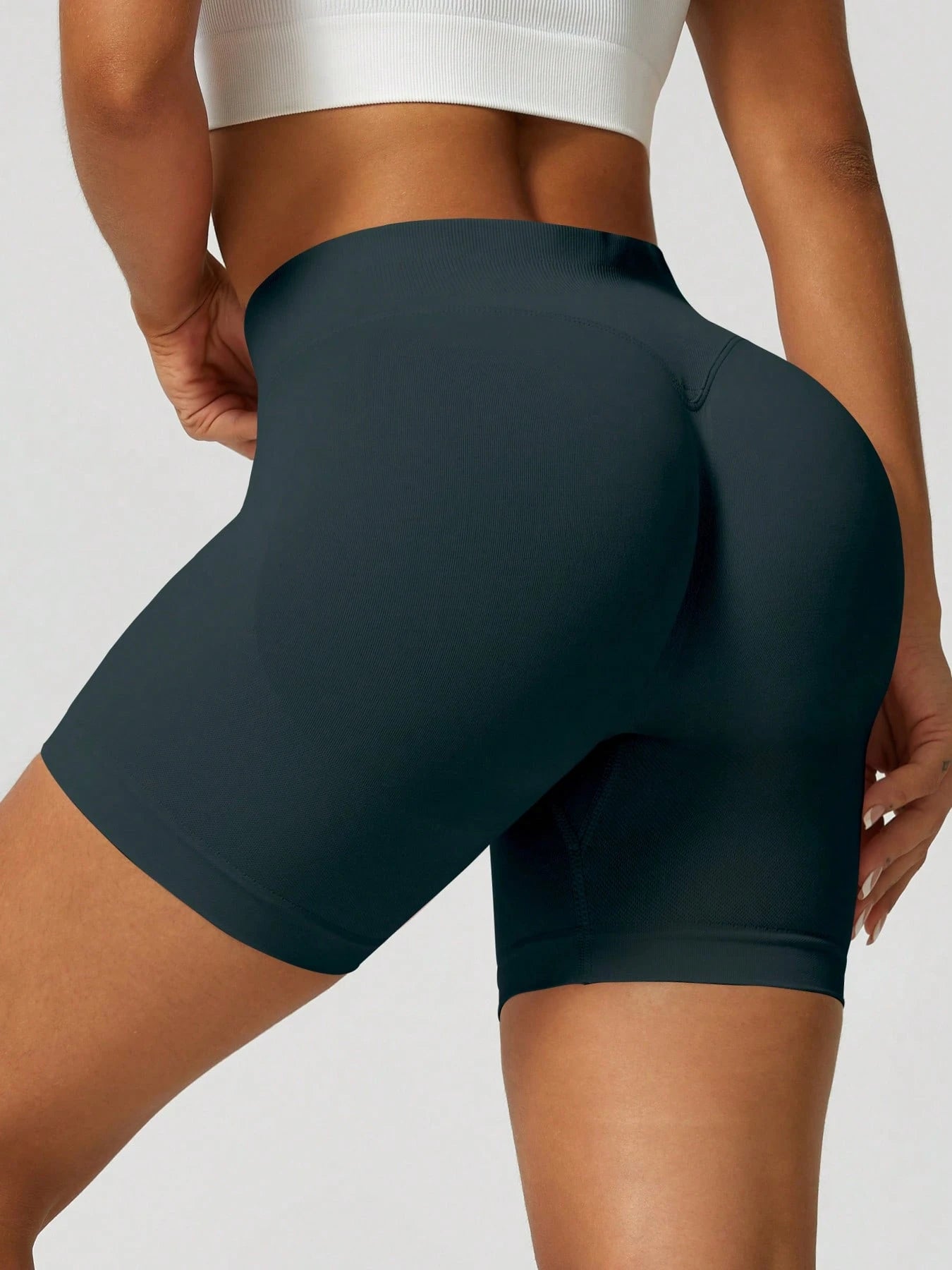 Sculpt high-rise seamless shorts The Quiet & Co. — back view natural shape — Dark Green